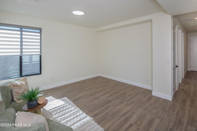 empty room with hardwood / wood-style flooring