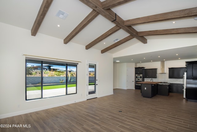 unfurnished living room featuring dark hardwood / wood-style flooring and lofted ceiling with beams