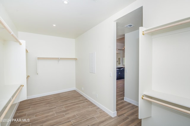 spacious closet featuring hardwood / wood-style flooring