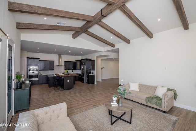 living room with vaulted ceiling with beams and dark hardwood / wood-style flooring