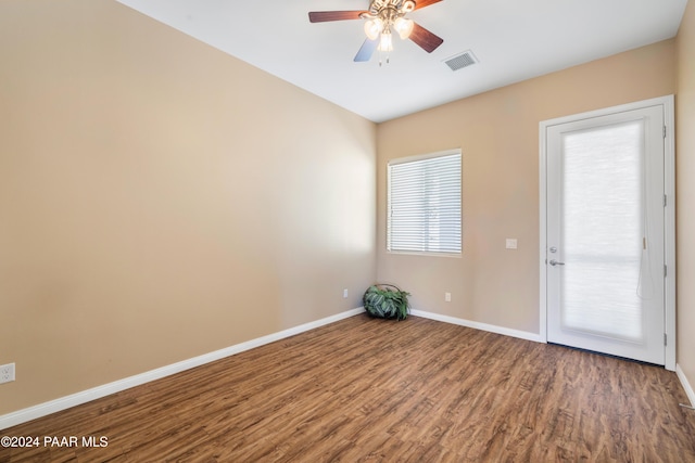 empty room featuring hardwood / wood-style flooring and ceiling fan