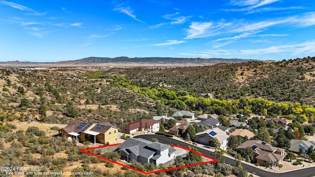 birds eye view of property featuring a mountain view