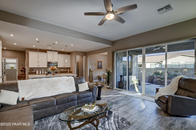 living room featuring ceiling fan