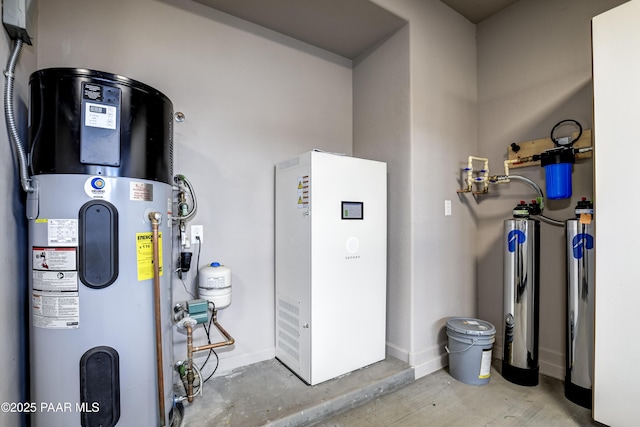 utility room featuring hybrid water heater