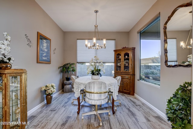 dining space with a chandelier