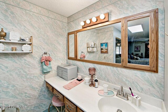 435 Jasmine Ln, Prescott, AZ 86301 - bathroom with connected bathroom, a textured ceiling, and vanity