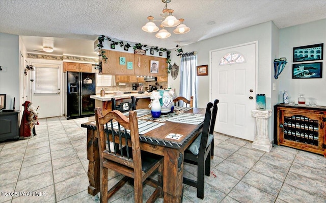 435 Jasmine Ln, Prescott, AZ 86301 - dining room featuring light tile patterned floors, a notable chandelier, and a textured ceiling