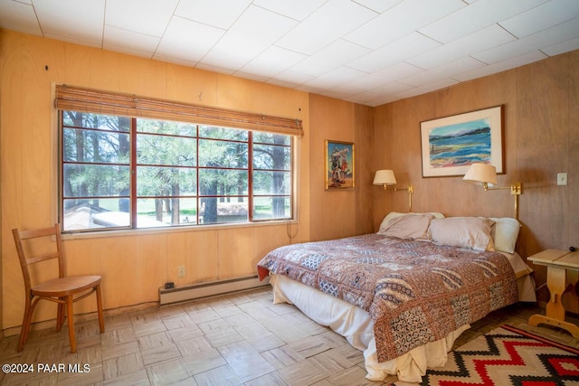 581 Cooper Ranch Rd, Williams, AZ 86046 - bedroom with a baseboard radiator and wooden walls