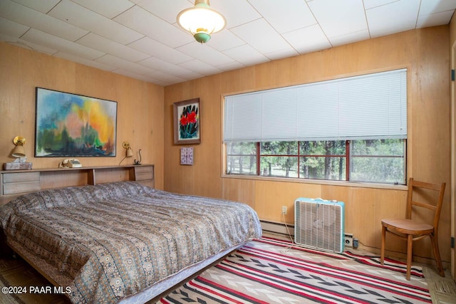 581 Cooper Ranch Rd, Williams, AZ 86046 - bedroom with a baseboard heating unit and wooden walls