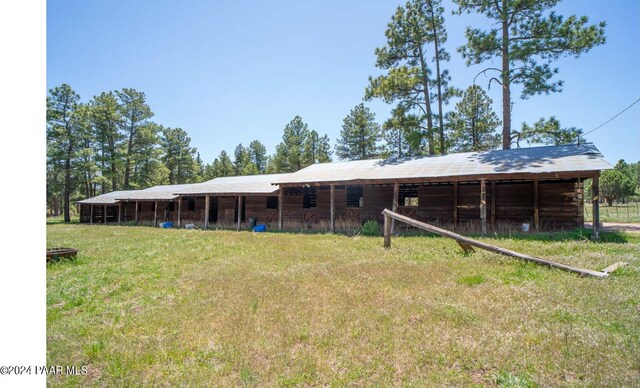 581 Cooper Ranch Rd, Williams, AZ 86046 - back of house featuring an outbuilding and an exterior structure