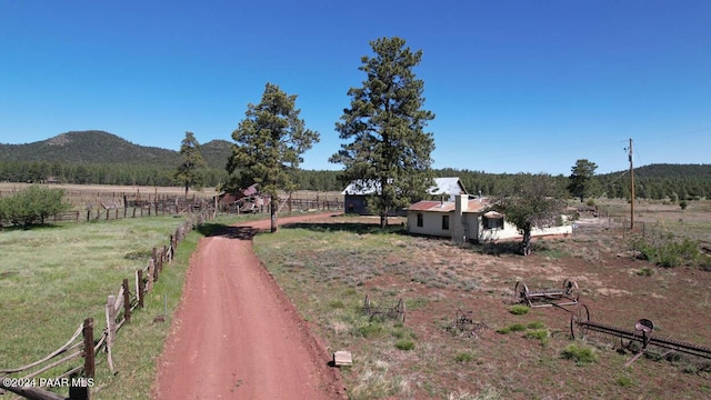 581 Cooper Ranch Rd, Williams, AZ 86046 - view of yard featuring fence, a mountain view, and a rural view