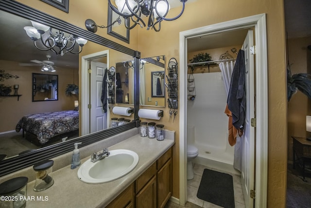 full bathroom featuring tile patterned flooring, vanity, toilet, a stall shower, and connected bathroom