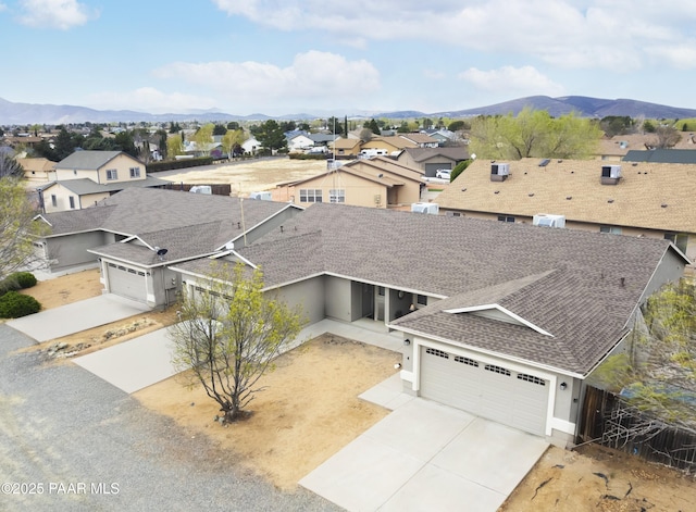 bird's eye view featuring a residential view and a mountain view