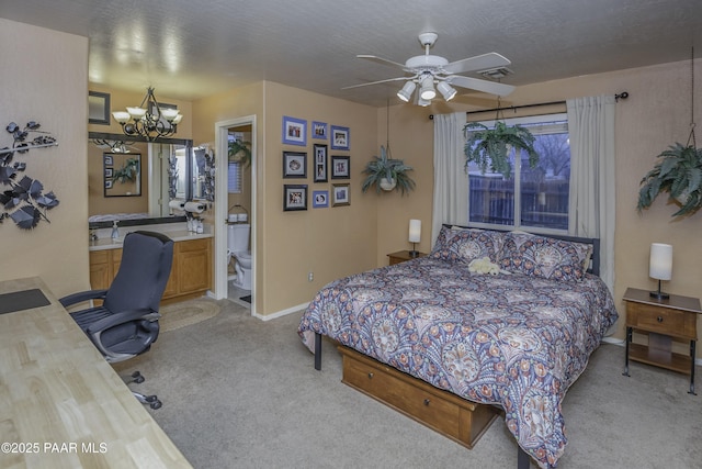 carpeted bedroom with baseboards, ensuite bath, a textured ceiling, and a chandelier