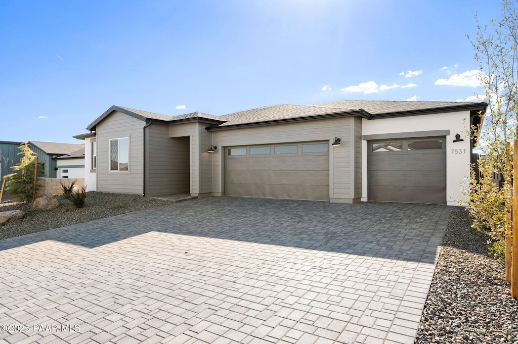 view of front of property featuring a garage