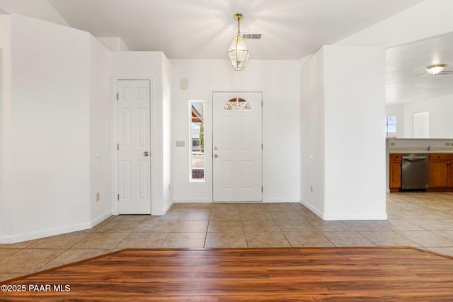 entrance foyer with light tile patterned floors, visible vents, and baseboards