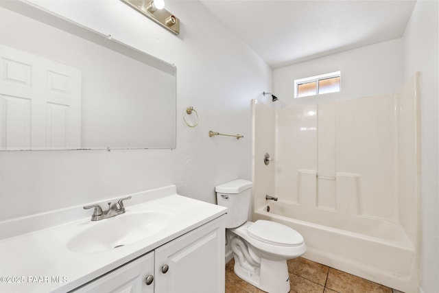 bathroom featuring tile patterned floors, toilet, shower / washtub combination, and vanity