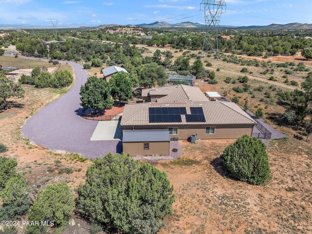 birds eye view of property featuring a mountain view