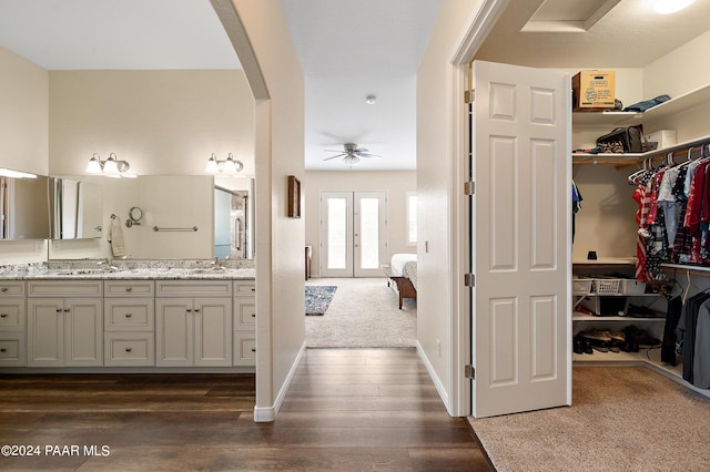 bathroom featuring ceiling fan, vanity, and hardwood / wood-style flooring