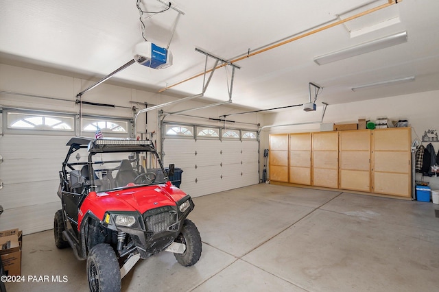 garage featuring a garage door opener