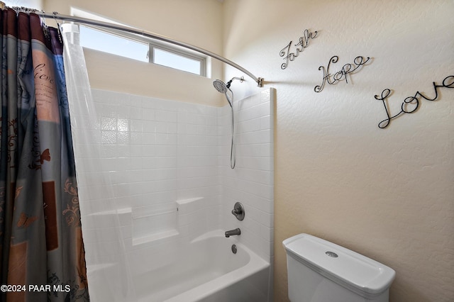 bathroom featuring toilet and shower / tub combo