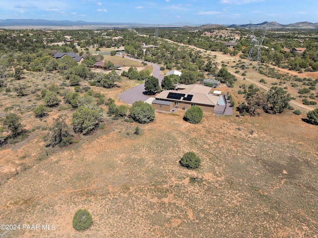 birds eye view of property featuring a mountain view