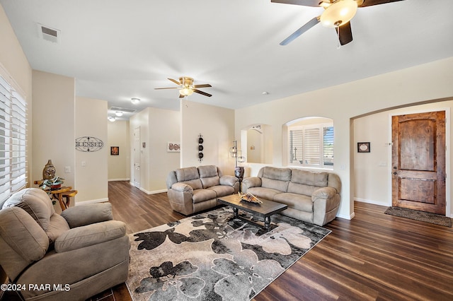 living room with ceiling fan, dark hardwood / wood-style flooring, and plenty of natural light