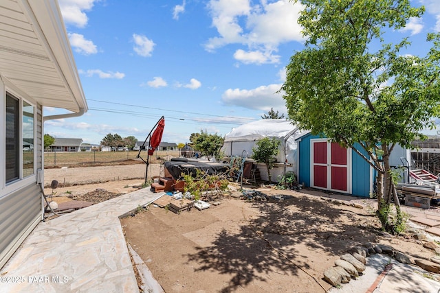 3161 N Valley View Dr, Prescott Valley, AZ 86314 - view of yard featuring fence, a storage shed, a patio, and an outbuilding