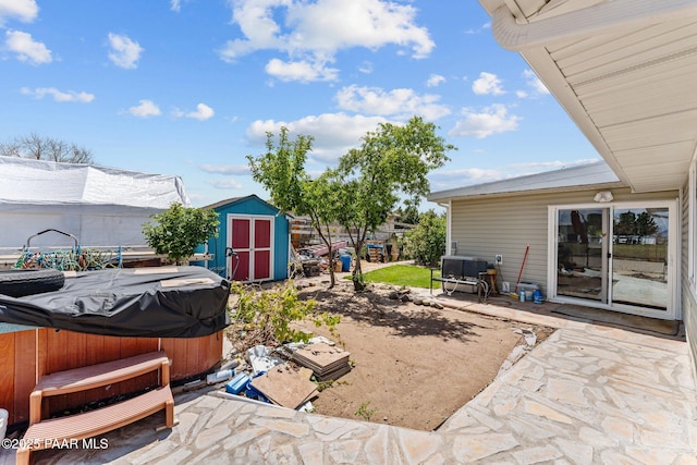 3161 N Valley View Dr, Prescott Valley, AZ 86314 - view of patio / terrace with an outdoor structure, a hot tub, fence, and a storage unit