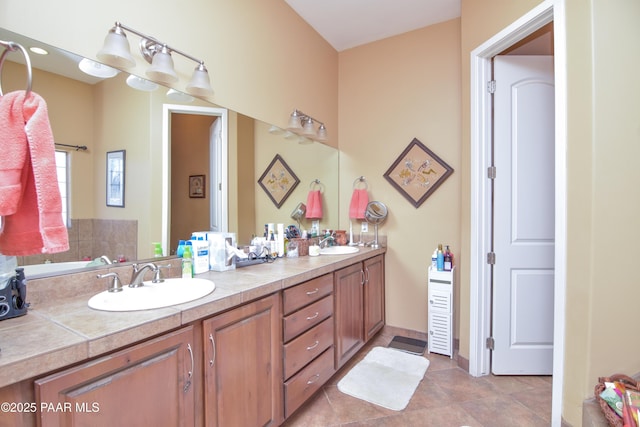 bathroom featuring double vanity and tile patterned floors