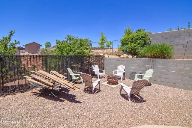 view of yard with an outdoor fire pit