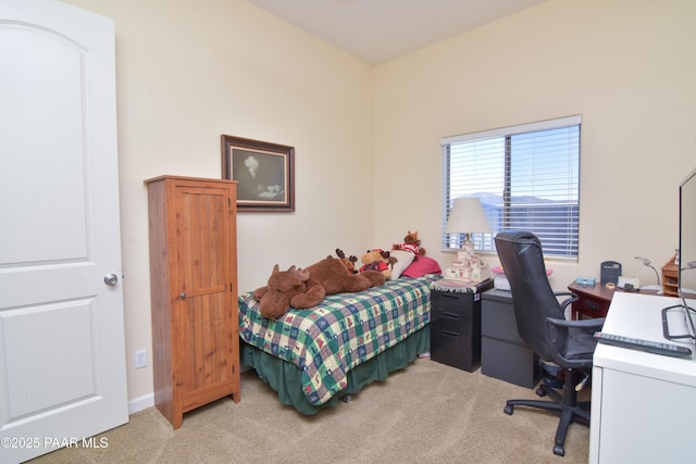 bedroom featuring carpet flooring and an office area