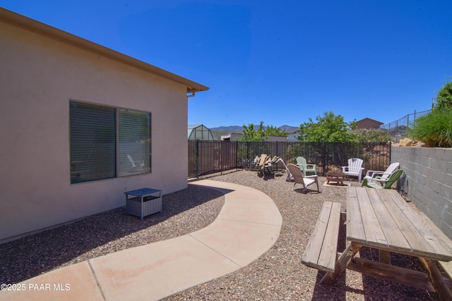 view of patio featuring a fire pit