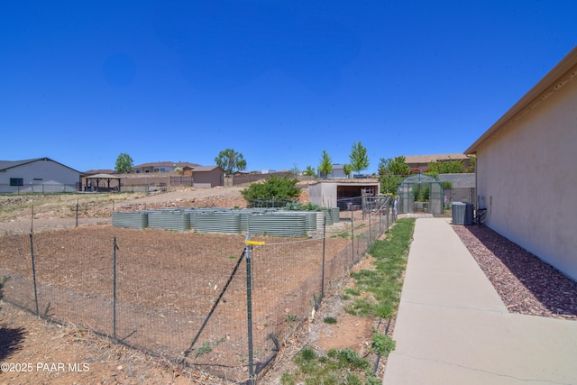 view of yard featuring central AC