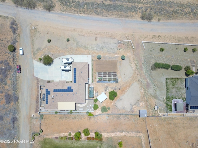 aerial view of sparsely populated area featuring a desert landscape
