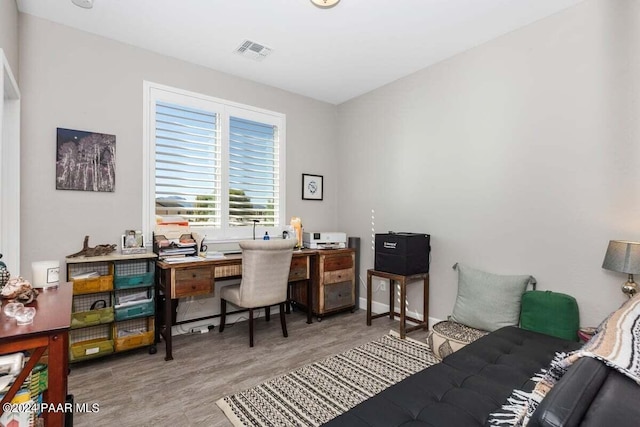 office area with light hardwood / wood-style flooring