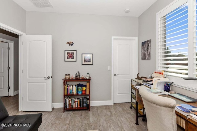 home office featuring light hardwood / wood-style floors