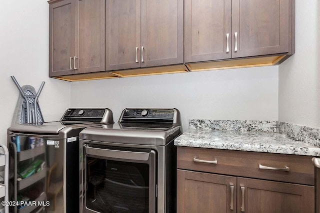 laundry room featuring cabinets and independent washer and dryer