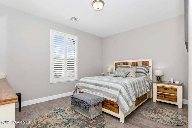 bedroom featuring hardwood / wood-style floors