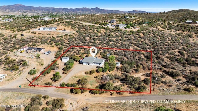 aerial view of property's location featuring a mountainous background and property parcel outlined