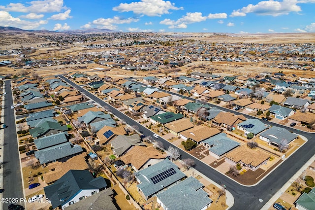 drone / aerial view featuring a mountain view and a residential view