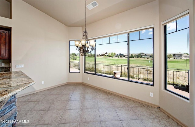 1498 Commonwealth St, Prescott, AZ 86301 - unfurnished dining area with healthy amount of natural light, a chandelier, golf course view, vaulted ceiling, and light tile patterned flooring