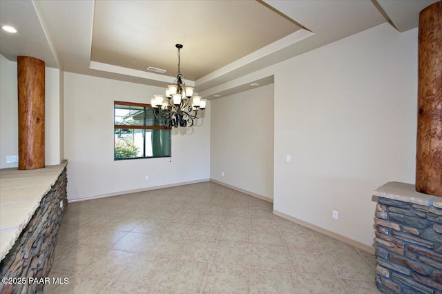 1498 Commonwealth St, Prescott, AZ 86301 - unfurnished dining area featuring a tray ceiling, a chandelier, and light tile patterned floors