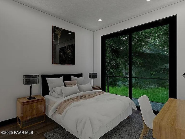 bedroom with dark wood-type flooring and a textured ceiling