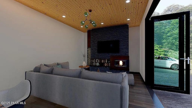 living room featuring a stone fireplace, dark hardwood / wood-style floors, and wooden ceiling