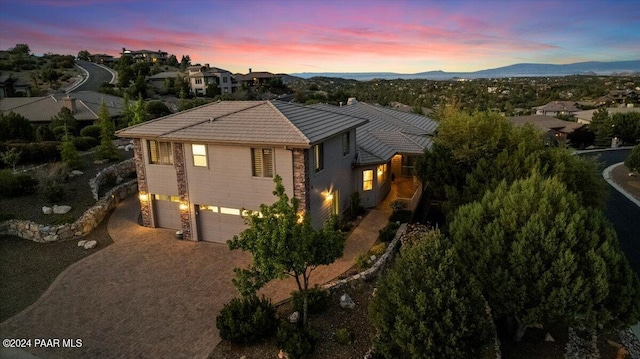 view of front of home featuring a mountain view and a garage