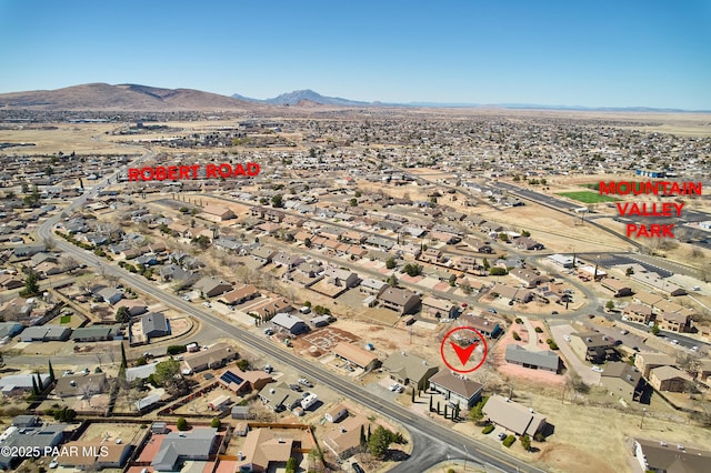 birds eye view of property with a mountain view and a residential view