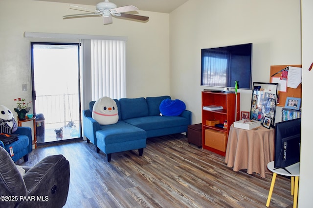 living room featuring plenty of natural light, wood finished floors, and ceiling fan