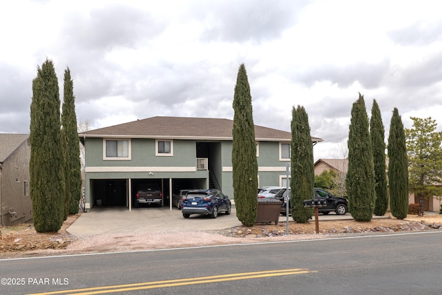 view of front facade featuring concrete driveway and an attached garage