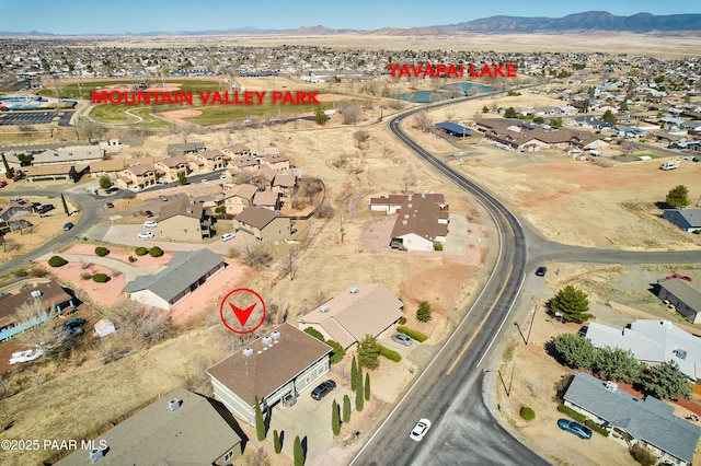 birds eye view of property featuring a mountain view and a residential view